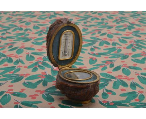An Edwardian novelty desk compass and thermometer, in gilt metal, in the case and shell of a walnut, 5.5 cm  