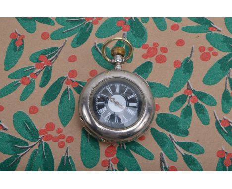 A late 19th early 20th century continental white metal 'Half Hunter' fob watch, with black and white enamel face, having whit