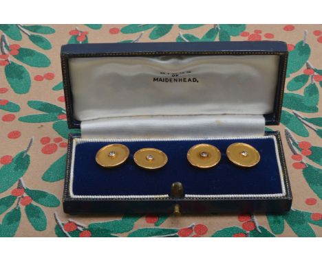 A pair of late Victorian or Edwardian 15ct gold and diamond cufflinks, 6.3g, the circular panels set with an old cut stone an