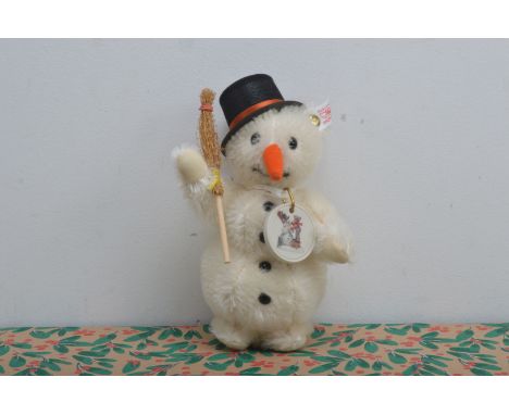 A modern Steiff limited edition white tag Snowman, wearing Goebel porcelain medallion by Hummell and dated 1999, 18cm high