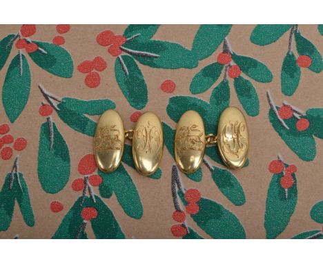 A pair of Edwardian 18ct gold cufflinks, oval panels, 22mm high, united by chain links, one panel with engraved lion, the oth