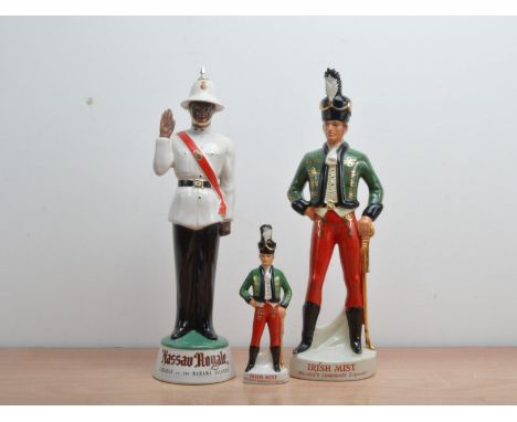 Three empty Novelty ceramic figural decanters, comprising a Nassau Royale example, 49cm high, and two Irish Mist examples, on