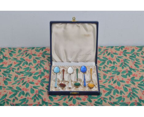 A pretty set of six Danish silver gilt and enamel coffee spoons, AF, in fitted box, each a different colour, some damaged unf