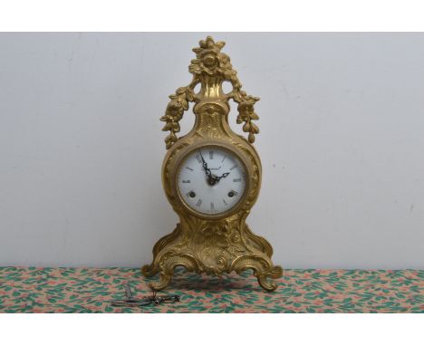 A mid 20th century or later Italian rococo style mantle clock, enamel dial (with damage) with Roman Numerals, marked 'Imperia