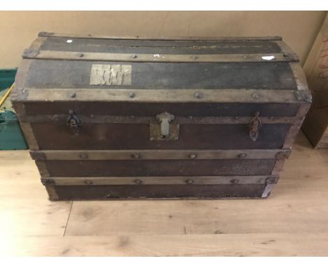 A large brass-bound trunk marked 'WF'