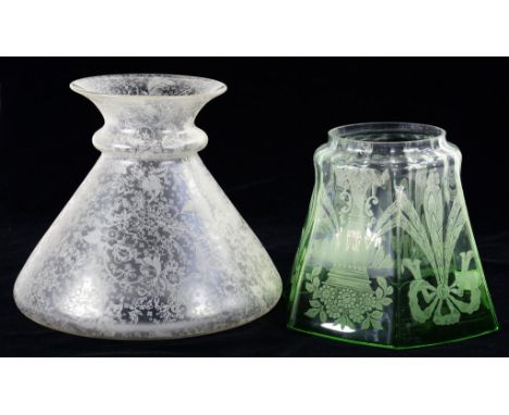 A EDWARDIAN GREEN TINTED GLASS LAMP SHADE WITH ACID ETCHED RIBBON GARLAND AND A CLEAR GLASS LAMPSHADE WITH ETCHED FOLIATE DEC