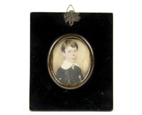 ENGLISH SCHOOL, 19TH CENTURY PORTRAIT MINIATURE ON IVORY OF A YOUNG BOY, IN A BLACK LACQUERED FRAME, WITH EMBOSSED OAK LEAF A