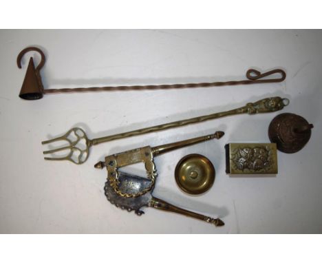 Collection of various vintage brass items comprising an antique betel nut cracker, a bell, candle snuffer, fire prong, small 