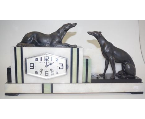 Art Deco French marble &amp; onyx mantle clock with two spelter dogs, together with wind up key, width 56cm approx