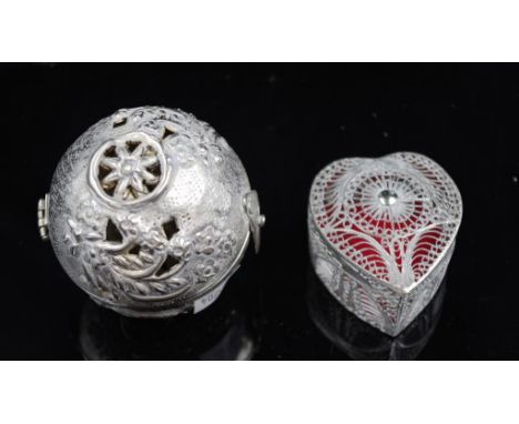 Oriental silver metal pierced pot pouri ball together with a filigree metal heart shaped trinket box