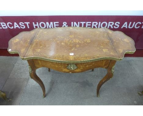 A 19th Century French marquetry inlaid rosewood serpentine sofa table