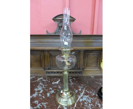A Victorian brass oil lamp