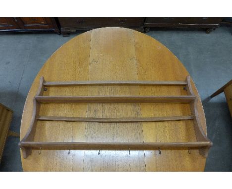 An Ercol elm plate rack