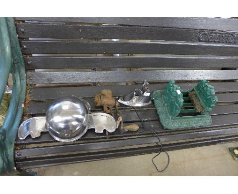 A reproduction boot scraper, Art Deco chrome boat lamp, cast iron mincer and a replica helmet