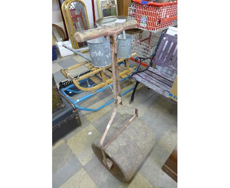 A cast iron garden roller