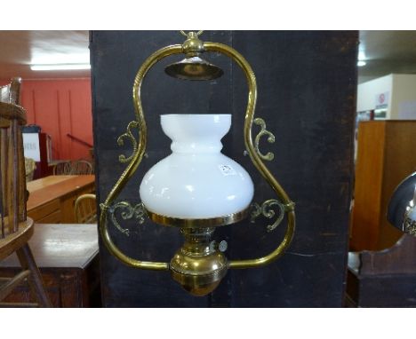 A brass hanging oil lamp