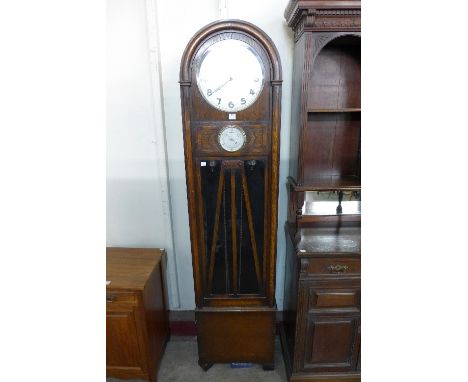 An Art Deco oak triple weight longcase clock