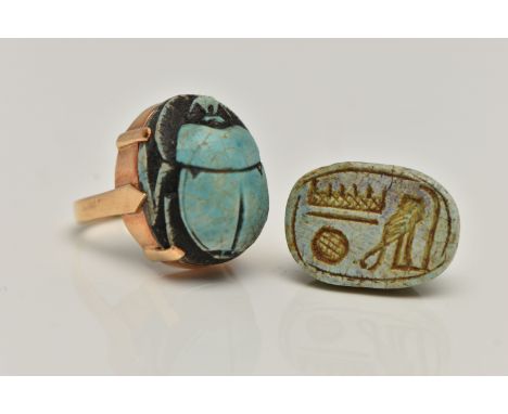 A YELLOW METAL SCARAB BEETLE RING, carved scrab beetle, collet set in a yellow metal mount, to a polished band, stamped 18k, 