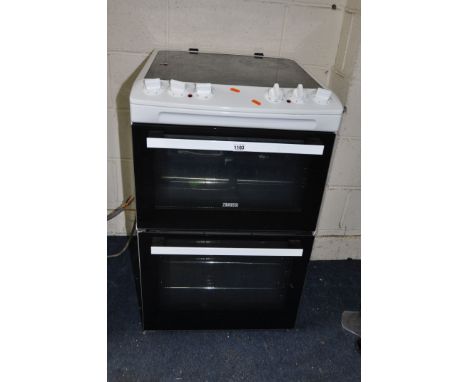 A ZANUSSI OVEN, with a ceramic hob, and two doors, width 55cm x depth 65cm x height 89cm (untested due to no plug)