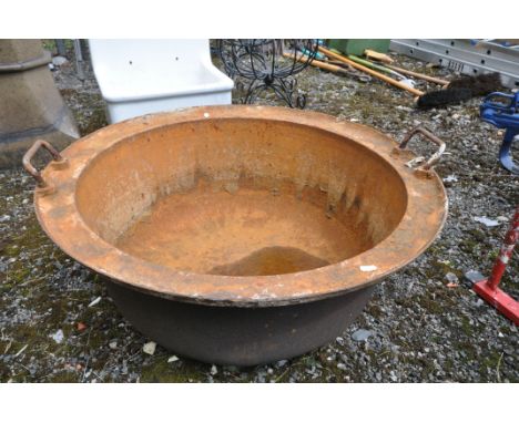 A VINTAGE CAST IRON TWIN HANDLED BASIN/BOWL, diameter 77cm x height 33cm