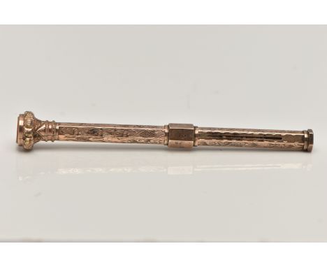A YELLOW METAL PROPELLING PENCIL, detailed with a floral pattern, personal engraving reads 'J.M X-MAS 1892', sliding mechanis
