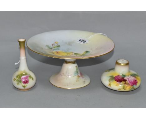 THREE PIECES OF ROYAL WORCESTER PORCELAIN, comprising a comport painted with roses, iron red no. W 6934 to the base, date cyp