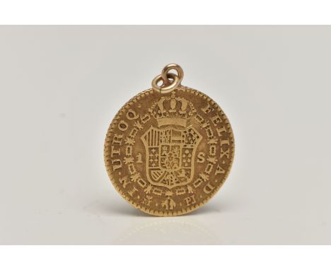 A YELLOW METAL 1779 SPAINISH COIN, Carol III D.G HISP.ET.IND.R, Felix.A.D IN.UTROQ, fitted with a small jump ring for suspens