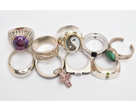 NINE WHITE METAL RINGS AND A CROSS PENDANT, to include a heavy silver, 'Montblanc' band ring set with an onyx and a citrine, 
