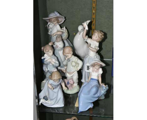 EIGHT NAO BY LLADRO FIGURES, comprising 1438 'Snowman', 1362 'Mother and Baby', 'Girl Playing With Dove', a white Dove, 1042 