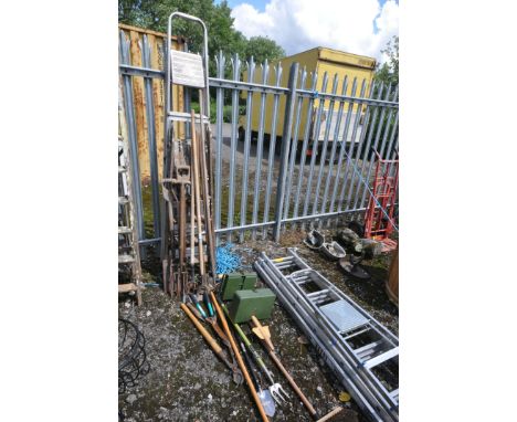 A SELECTION OF VINTAGE GARDEN TOOLS, to include three forks, a spade, rakes, etc, some newer garden tools, an aluminium step 
