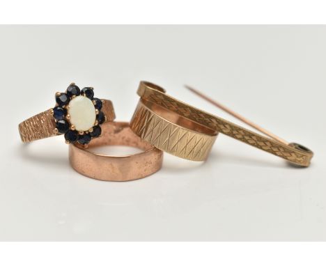 THREE 9CT GOLD RINGS AND A 9CT GOLD BAR BROOCH, the first a plain polished band ring , a textured band ring, and a opal and s