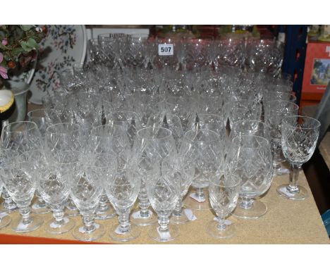 A GROUP OF CUT CRYSTAL DRINKING GLASSES,  comprising a set of twelve wine glasses, a set of twelve white wine glasses, a set 