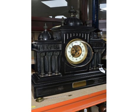 A LARGE BLACK SLATE MANTEL CLOCK  c1908, of architectural form, the case having six columns, figural frieze and dome above, t