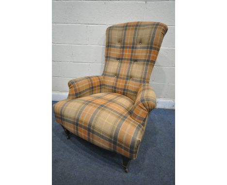A TARTAN UPHOLSTERED HIGH BACK ARMCHAIR, on tapered front legs and ceramic casters, width 82cm x depth 86cm x height 109cm (c