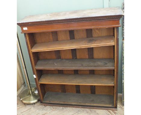 A mahogany four shelf floor standing bookcase