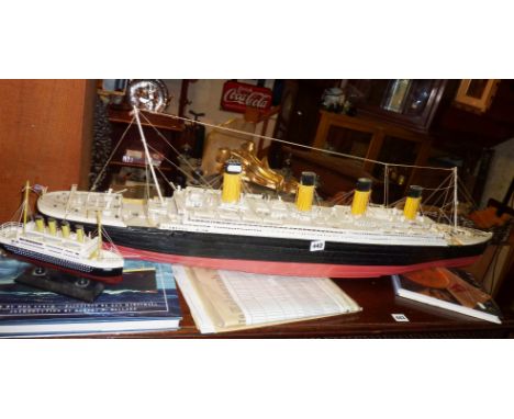 A scale model of the Titanic (kit), together with history etc of the vendor's relatives who went down with the ship, and news