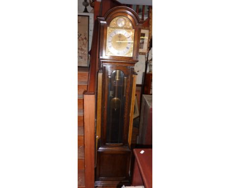 Oak cased grandmother clock with chain driven movement, bevelled glass panel to door and silvered chapter ring