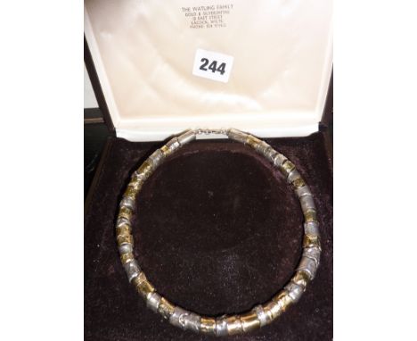 Solid silver and gilt Modernist collarette or necklace with textured finish in original case. By Graham Watling of Lacock and