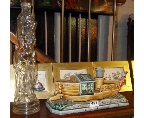 French majolica Sarreguemines-style humidor in the shape of a boat, and a glass figural bottle