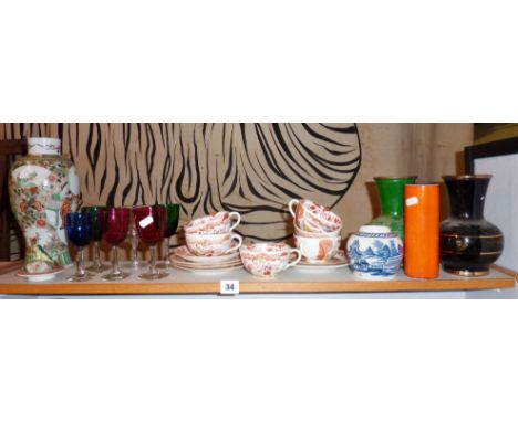 Studio Pottery orange vase, Chinese cups & saucers, coloured glasses, oriental lidded vase etc (one shelf)