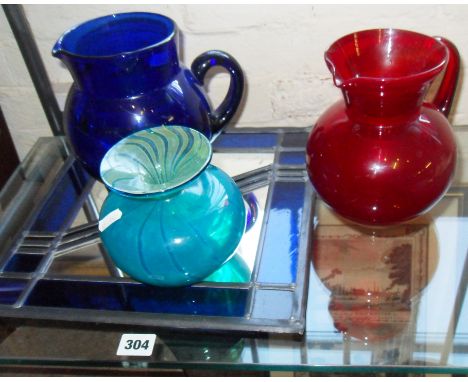 Mdina glass vase, blue glass water jug, another ruby jug and a modern stained glass panel