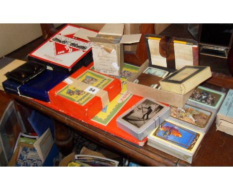 Vintage board games including "Touring Europe" & Monopoly, unopened playing cards, and Reeves Artist's watercolour sets