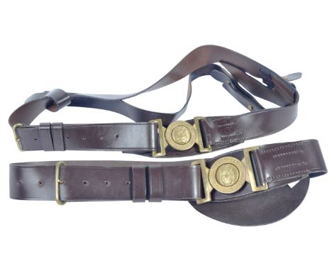 Two 20th Century British Army / Royal Marines Sam Browne leather uniform belt. Brown leather construction with Royal Marines 