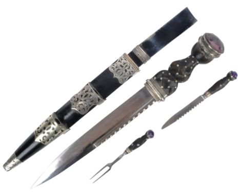 A 19th century Victorian Scottish Highland Dirk dagger. Having a silver plate mounted purple glass faceted pommel and carved 