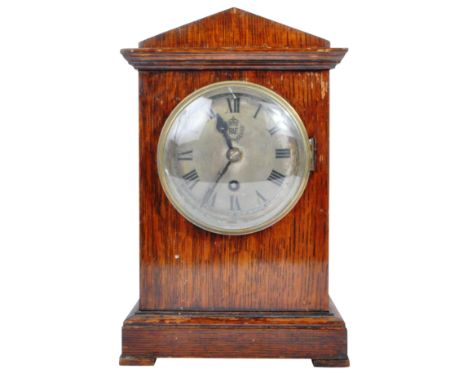 A WWII Second World War era RAF Royal Air Force officers mess clock. The oak cased mantle clock having a&nbsp;triangular pedi