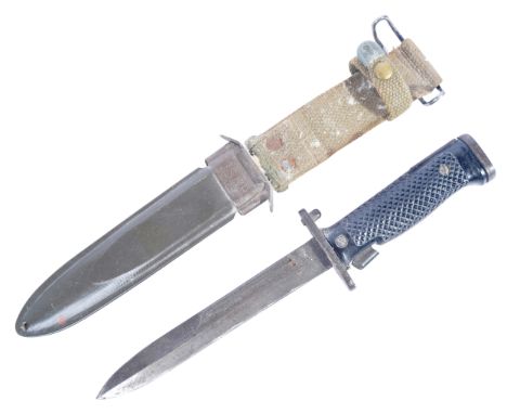 A post-WWII Second World War American US Army ' M8 ' rifle bayonet and scabbard. Bayonet with black grips and working press s