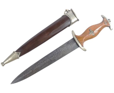A WWII Second World War type Third Reich Nazi German SA dagger. The dagger having a shaped wooden grip with inset SA roundel 