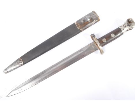 A 19th Century Victorian Lee Metford 1888 pattern MKI Type 2 rifle bayonet. Push button release, with wooden grips, short qui