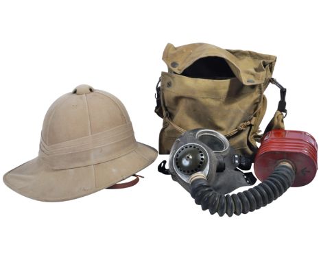 An original WWII Second World War British Army Wolseley pattern tropical pith helmet and respirator gas mask. The helmet of u