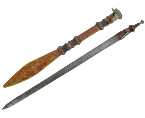 An original 19th Century North African&nbsp;Kaskara / Takouba sword. Round metal pommel with clad tooled leather handle and l